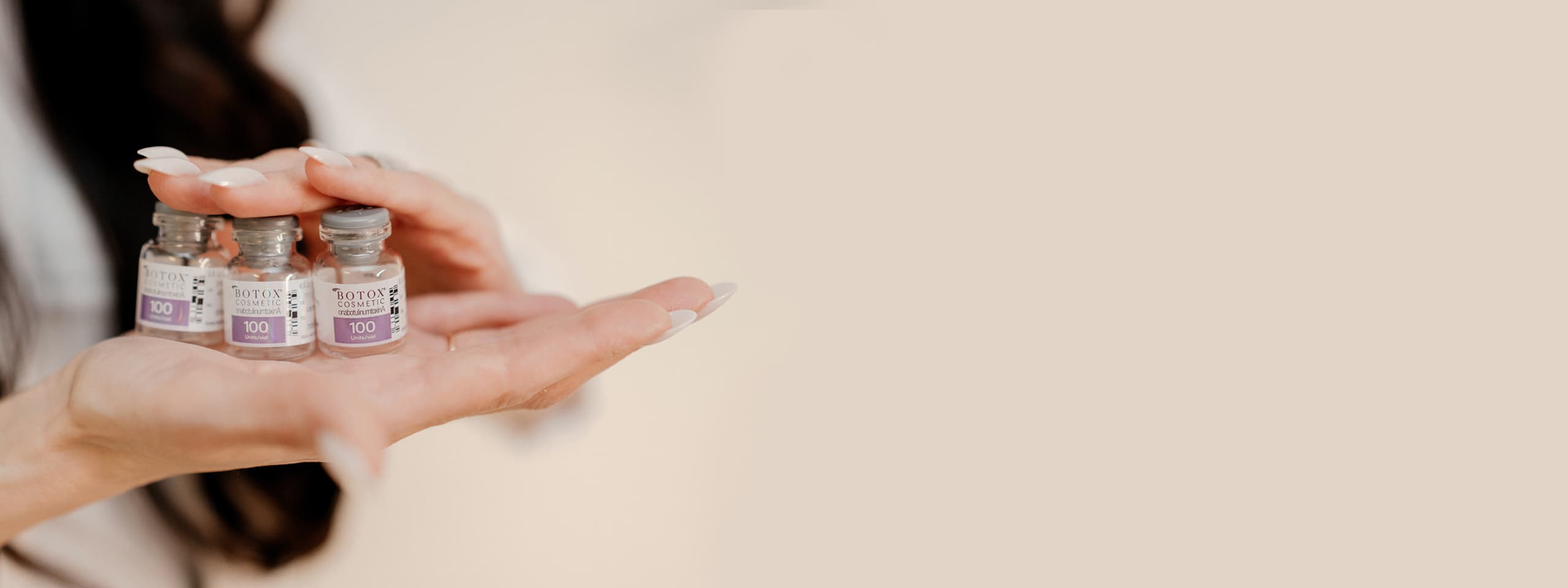 Helen Petrov holding Botox Cosmetic vials — Flawless Aesthetics, Renton WA